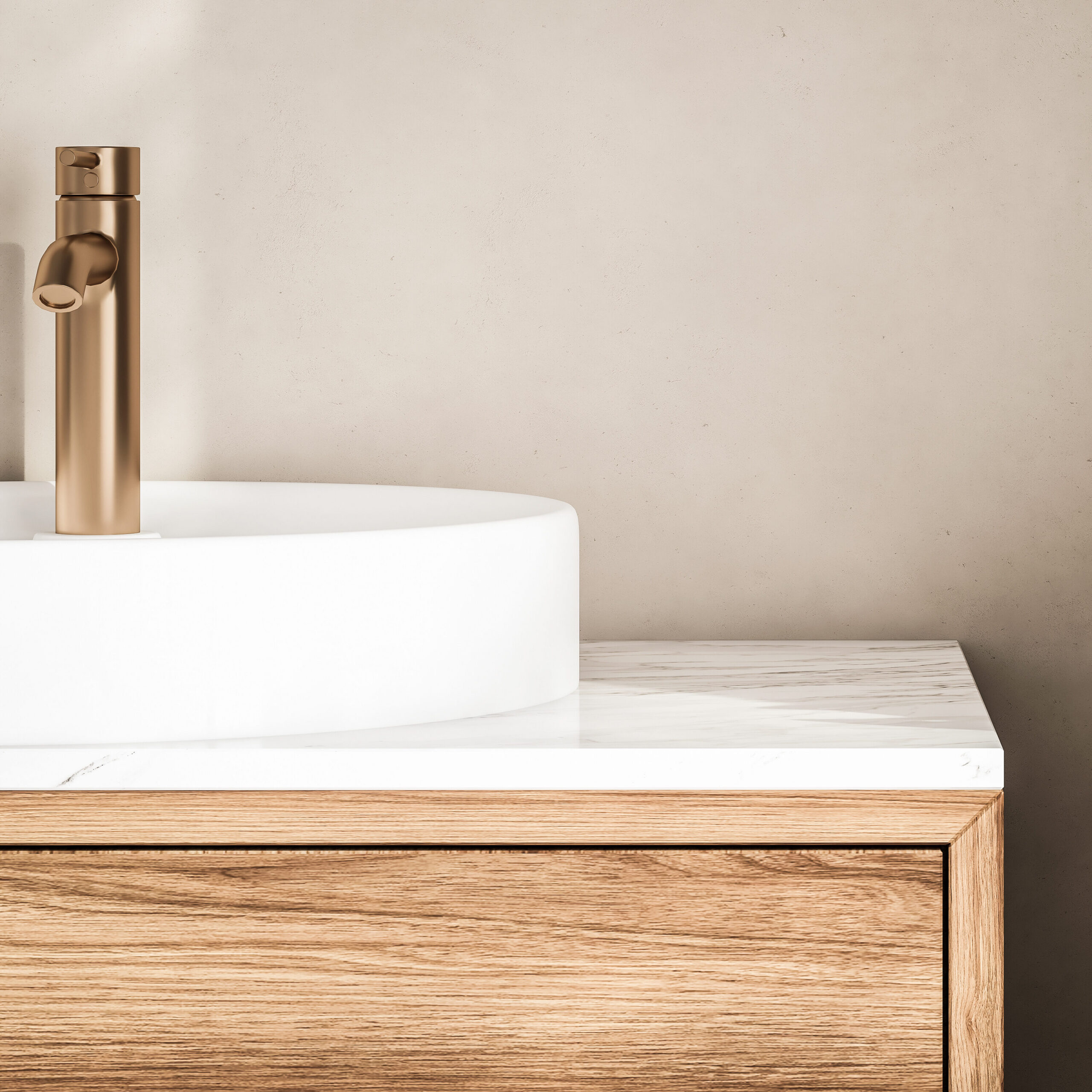 Close-up of a modern bathroom with a white vessel sink, gold faucet, wood vanity with a marble countertop, and a green potted plant against a beige wall.